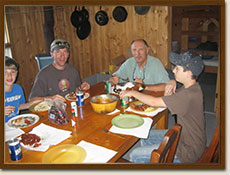 Enjoying a meail at a Wapesi Lake Cabin